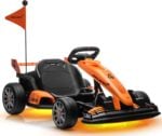 Studio white background front quarter view of First Ride On McLaren officially licensed kids racing toy car with safety flag