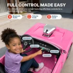 Dashboard view of a girl playing with the Bluetooth audio inside the pink First Ride On Dodge Charger RT