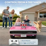 Parents using the 3-speed remote control to guide children in the pink First Ride On Dodge Charger RT