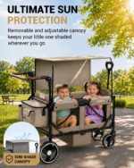 Removable adjustable canopy shading two kids riding in the brown wagon stroller at the park